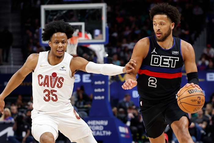 Mar 1, 2024; Detroit, Michigan, USA; Detroit Pistons guard Cade Cunningham (2) dribbles defended by Cleveland Cavaliers forward Isaac Okoro (35) in the first half at Little Caesars Arena. Mandatory Credit: Rick Osentoski-USA TODAY Sports